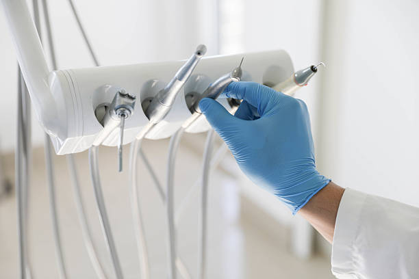 Professional Tooth Extraction technician working in Monticello, IA